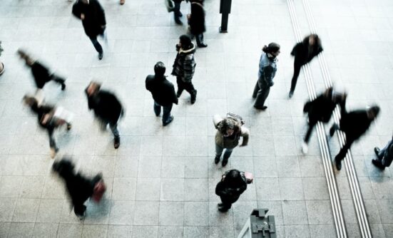 Taken from above of people walking in the street